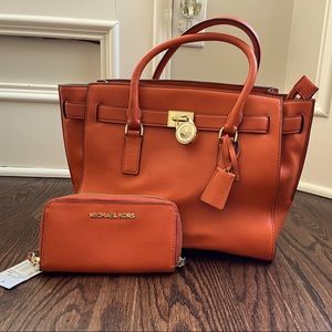 Orange Michael Kors purse and matching wallet!